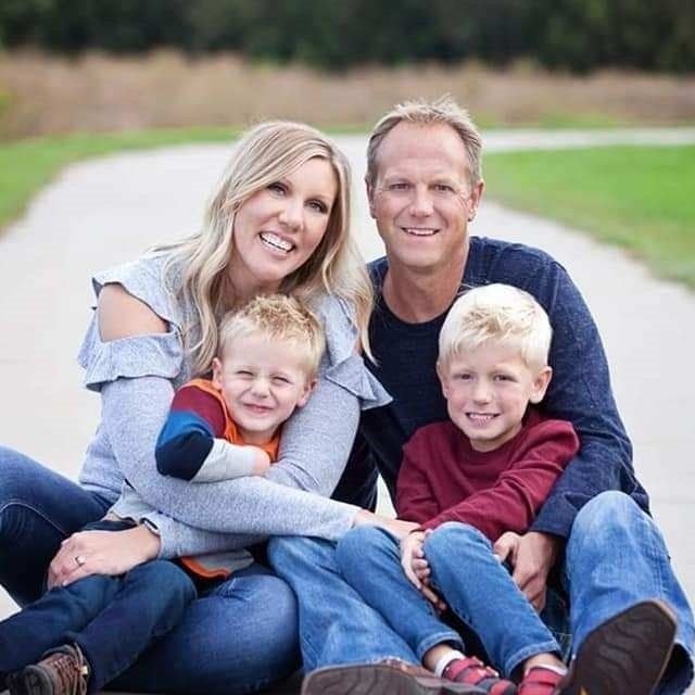 Jon Wallenburg, owner of Solid Rock Landscaping, with his family