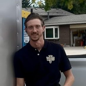 Wes, owner and master plumber at Western Plumbing Solutions, in a branded shirt